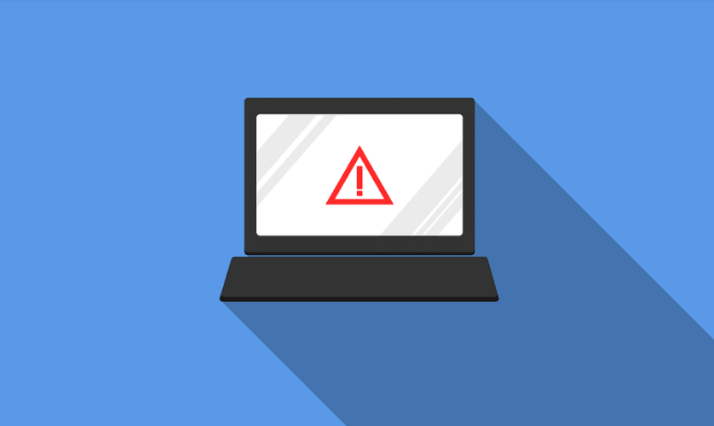 An image of a laptop with an exclamation mark on the screen and a danger icon